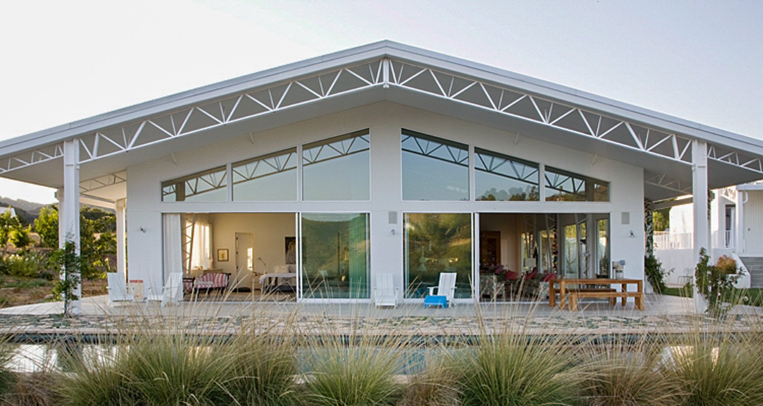 Topenga House — a finished Miracle Truss steel building framed by hills and outdoor living space